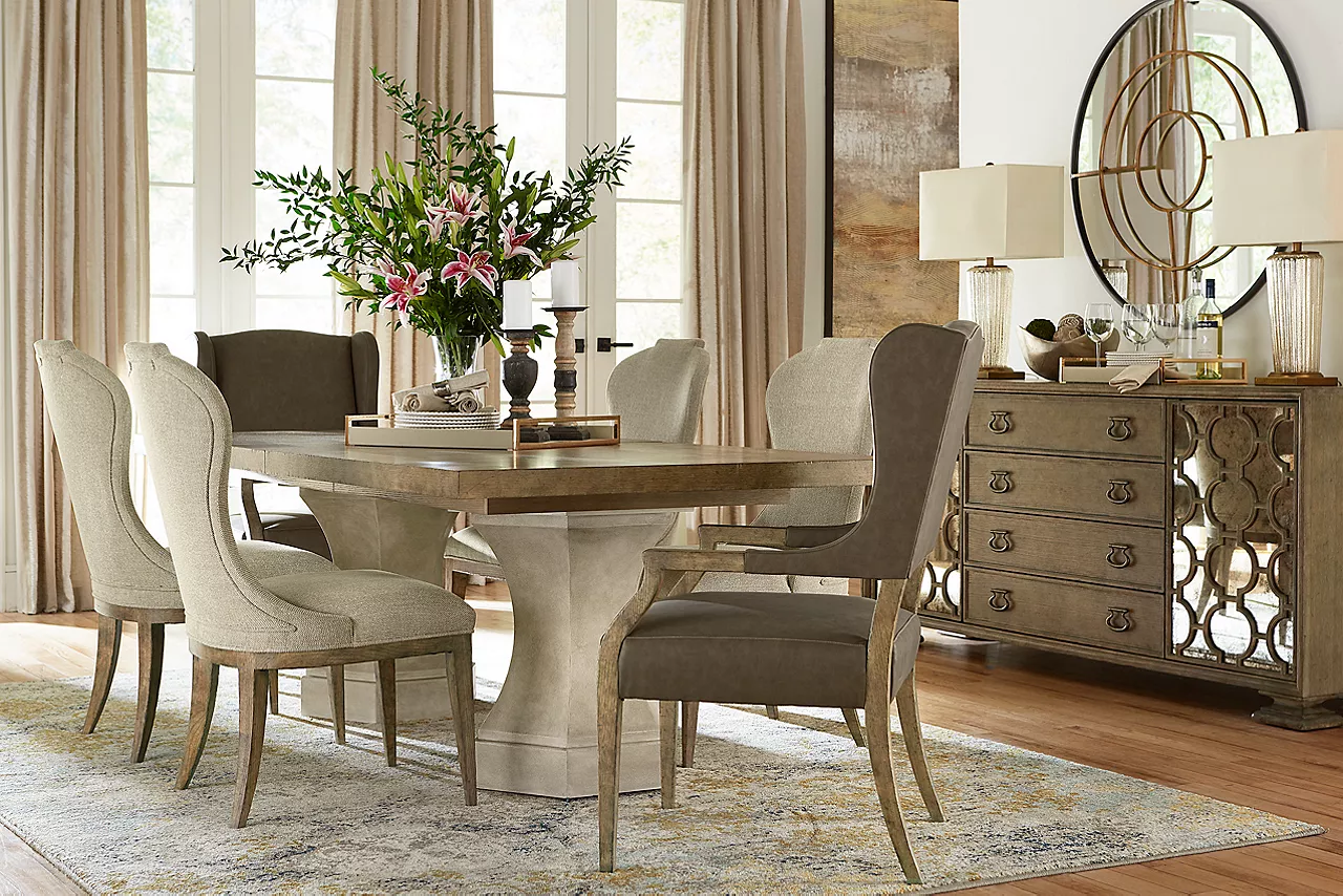 Westcliffe Dining Table, Dining Chairs, Performing Host Armchairs, and Buffet in Burnished Bark in a room scene.